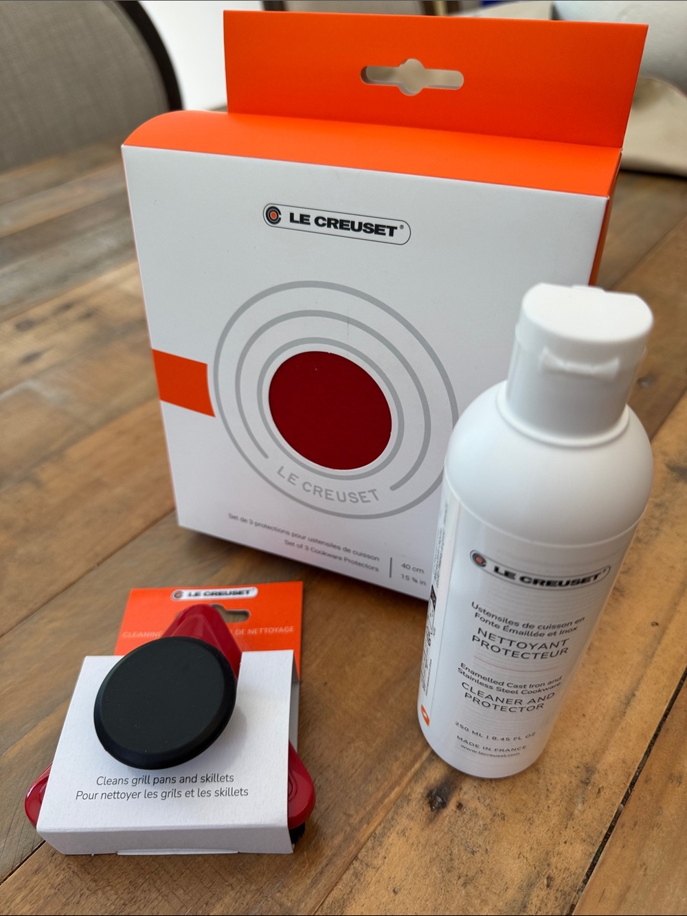 Le Creuset cleaning brush, three cookware protectors, 8 oz cleaner & protector